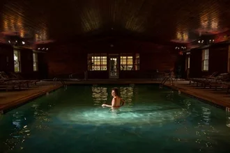 Woman enjoying a swim in the indoor pool